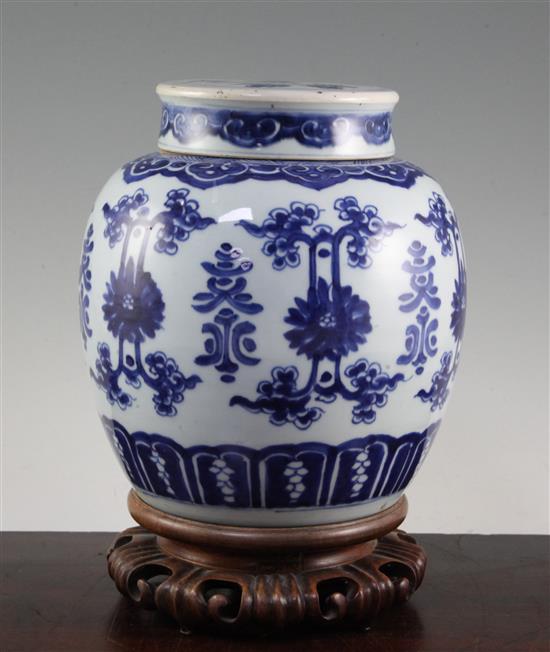 A Chinese blue and white ovoid jar and cover, 19th century, 22.5cm, wood stand